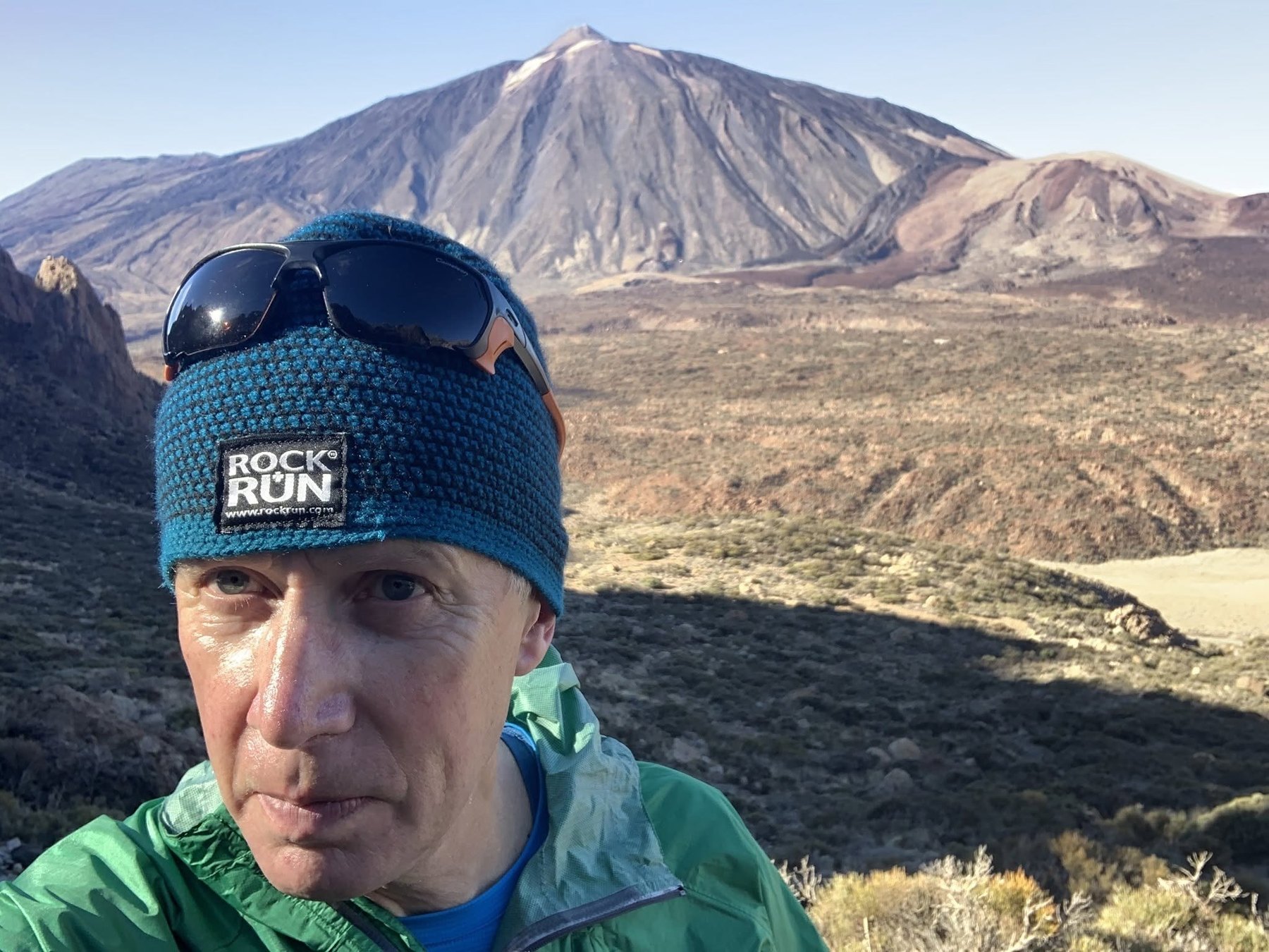 Andy Hyslop takes a field selfie in dry mountain terrain