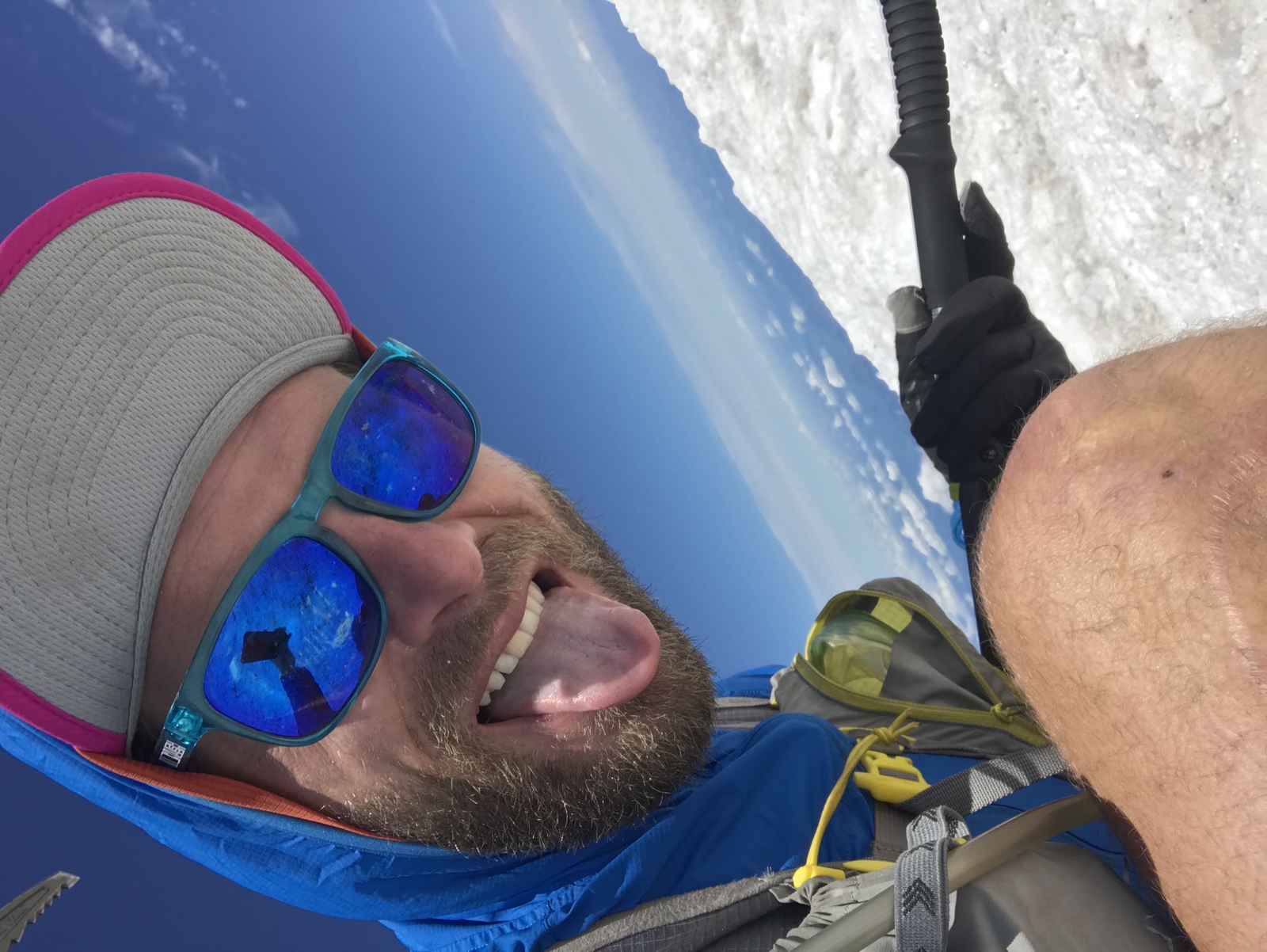 Jason Hardrath takes a solo mountain selfie in sunglasses on snow