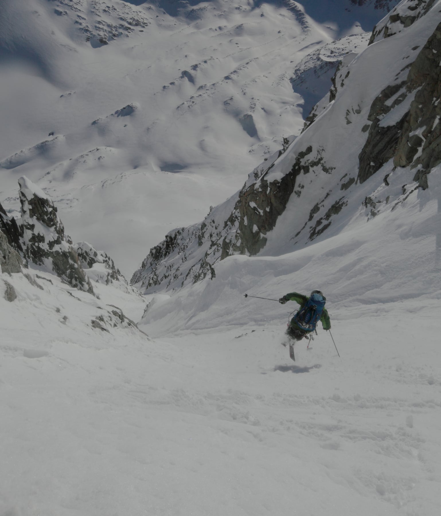 Ryan Boyer jump-turns down the steep snowy Angelique couloir in Chamonix